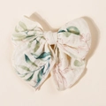 Detailed view of beige muslin fabric bow hair clip with green leaf and brown branch patterns - 11.5x10cm / Beige Green Red Floral (#11)