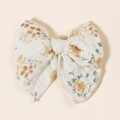 Close-up of floral bow hair clip showing detailed linen texture and edge stitching - 11.5x10cm / White Purple Floral (#12)