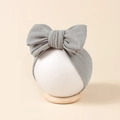 Close-up of baby headband with large gray glitter bow on a white display mannequin - 16*8.5cm / Gray