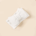 Detail of soft white crochet knitted baby headband featuring a large double bow design - 16*8.5cm / White