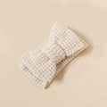 Close-up of beige knitted bow headband showing intricate texture and soft elastic fabric - 16*8.5cm / Apricot