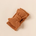 Detail of knit double-layered large bow headband for babies in ginger yellow textured yarn - 16*8.5cm / Rust
