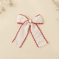 Detailansicht der bestickten Spitzen-Haarschleife mit eleganten roten Bogenkanten - 10*10CM / Roter Rand