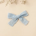 Close-up of light blue lace bow hair clip with floral embroidery and hollow details - 8.5x6cm / Blue