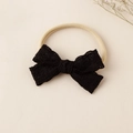 Detail eines schwarzen Spitzen-Stirnbands mit beigem, hochelastischem Nylonband für Babys - 8.5x5cm / Schwarz