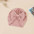 Detailed close-up of pink ribbed baby beanie featuring a large decorative bow - 17.5x17 cm / Dusty Pink (#8)