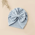 Detail of baby light blue jacquard knit beanie with an oversized bow on soft fabric - 17.5x17 cm / Sky Blue