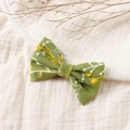 Detailed view of handmade green linen hair clip with yellow floral embroidery art - 8.5*5.5cm / Green