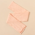 Close-up of soft light pink nylon jacquard baby headband with intricate knit pattern - Light Orange