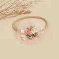Detailed view of handmade lace flower baby headband with soft nylon elastic strap - Mesh Pink