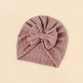 Macro shot of stretchable jacquard fabric texture on pink baby bow turban hat - Dark Pink