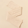Close-up of beige nylon jacquard baby headband with soft knitted cable texture - 115-120cm / Off-White (#20)