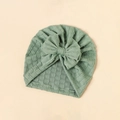 Detailed texture of bean green baby turban hat with a large decorative bow - Bean Green