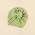 Close-up of light green jacquard baby turban hat with a large decorative bow - Grass Green