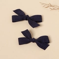 Pair of dark blue linen bow hair clips with textured fabric on a neutral background - Navy Blue
