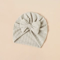 Detailed view of grey baby turban hat with popcorn fabric texture and large bow - Light Gray