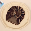 Deep brown velvet baby turban hat featuring a large elegant bow for winter warmth - Brown