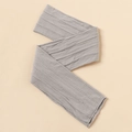 Close-up of grey cable-knit baby headband showing the elastic nylon fabric texture - Gray