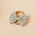 Detail of embroidered mint green cotton bow with natural wooden ring for babies - Light Green