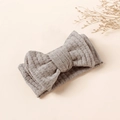 Gray waffle knit baby headband with a double-layered bow on a beige surface - 16x8.5cm / Gray