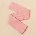 Close-up of pink cable knit nylon headband fabric with detailed braided texture for infants - Deep Pink