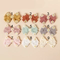 Détails de neuf nœuds pour cheveux en coton avec broderie marguerite en tons pastels - Couleur Aléatoire