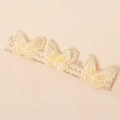 Dettaglio fascia per neonati in pizzo con tre farfalle ricamate in 3D e paillette lucide - Giallo