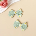 Détail de barrettes nœuds en coton vert menthe avec broderie marguerite pour filles - Cyan