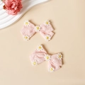 Detail of pink embroidered bow hair clips with white daisy patterns for children - 2 Pcs/Set / Pink