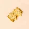 Close-up of mustard yellow baby headband with chiffon daisy flower bow detail - Turmeric