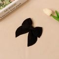 Detalle de pinza para el pelo con lazo negro en tela de gofre sobre fondo elegante - 9# Negro