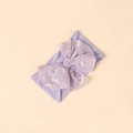 Detail of lavender baby headband with soft nylon fabric and large floral daisy bow - Purple