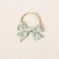 Bandeau bébé en nylon rose avec un nœud à carreaux verts et motifs cerises - Vert clair