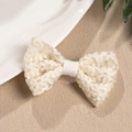 Detail of white crochet lace bow hair clip featuring intricate floral embroidery textures - Duckbill Hair Clips / Beige