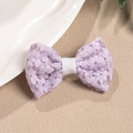 Detail of lavender floral lace bow hair clip with white ribbon core and embroidery texture - Purple