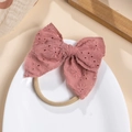 Close-up of pink embroidered lace bow with high-elastic band for baby hair accessory - Deep Pink