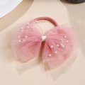 Détail du nœud rose en tulle avec perles fantaisie pour bébés et jeunes enfants - Rose