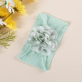 Detail of baby nylon headband with a light green and white checkered fabric flower decor - Light Green