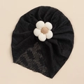 Detailed macro of black lace baby turban with a 3D textured cream fabric flower accent - Black