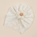 Detail of baby white lace turban hat with a large 3D floral decoration and mesh texture - Off White