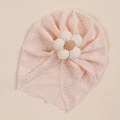 Detail of baby pink lace turban hat with a 3D fabric flower on a beige background - Light Pink