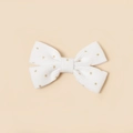 Détail du nœud papillon en velours côtelé blanc avec paillettes dorées pour filles - Blanc