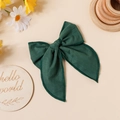Detail of dark green linen hair bow with stitched edges on a rustic aesthetic background - Dark Green