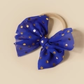 Detail of baby headband with oversized dark blue mesh bow and gold polka dots - Blue