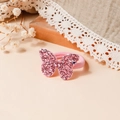Dettaglio dell'elastico per capelli con farfalla di paillettes rosa per bambina con decoro - Rosa Antico