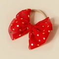 Detailed view of a red mesh bow headband with golden foil polka dots for babies - Red