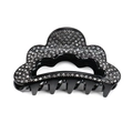 Macro detail of wave-shaped black acrylic hair claw clip with sparkling rhinestones - Black