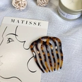 Minimalist acetate hair comb with tortoiseshell pattern on white textured background - Dark Tortoiseshell