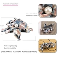 Detail view of 7.1cm acetate flower hair clip with large pearl center and spring clip - Camo Black