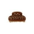 Close-up of mini acetate hair claw with amber crystals and gold base on white background - Coffee